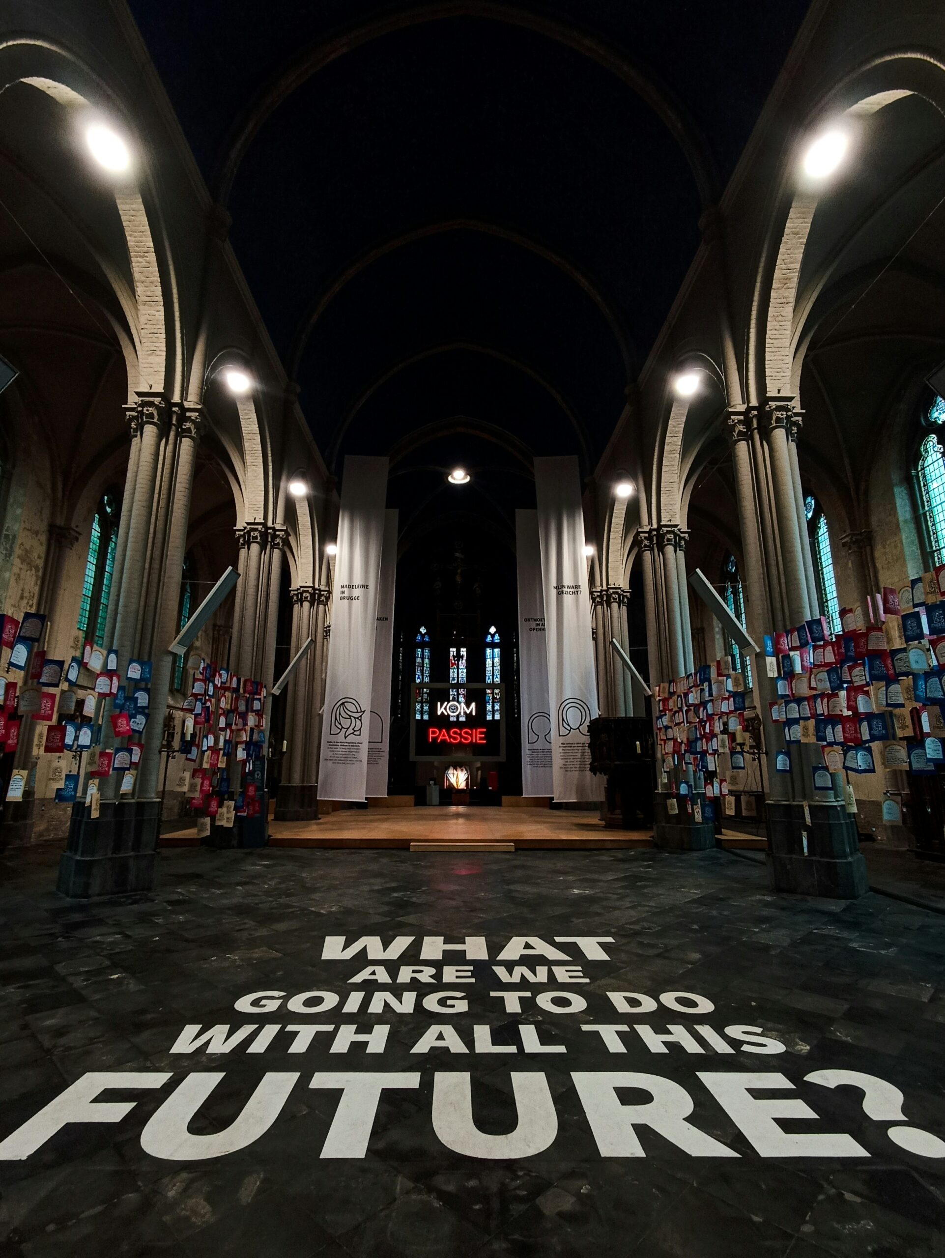 'What are we going to do with all this future' is written on the floor of an ancient cathedral.